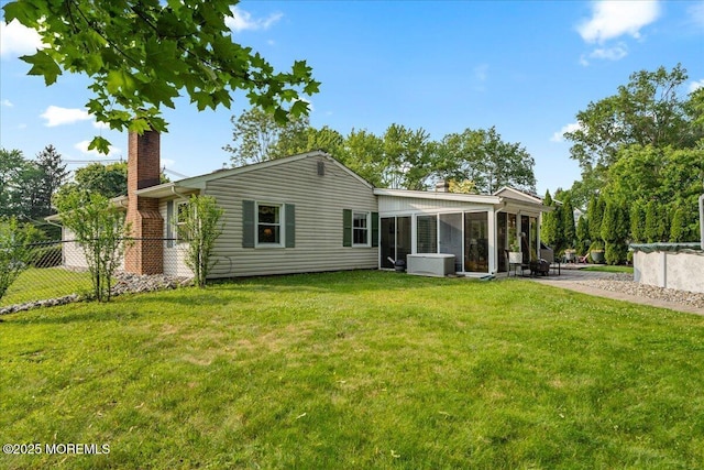 23 Spring St, Franklin Twp, NJ 08873 - rear view of property featuring a chimney and a sunroom