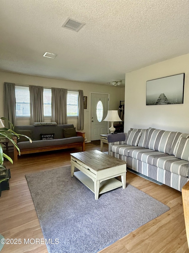7 S Seas Ct, Barnegat, NJ 08005 - living area featuring a textured ceiling and wood finished floors