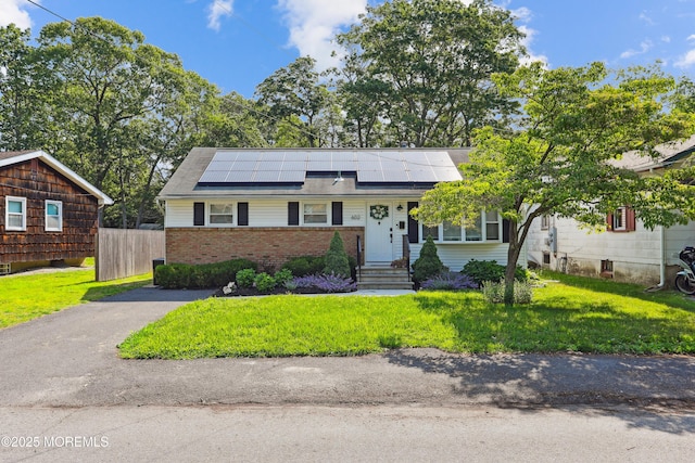 602 Butler Ave, Point Pleasant, NJ 08742 - view of front facade featuring roof mounted solar panels and brick siding