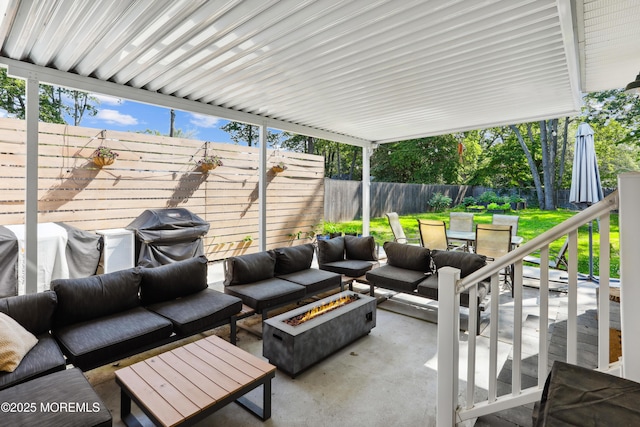 602 Butler Ave, Point Pleasant, NJ 08742 - fenced backyard with an outdoor living space with a fire pit, a patio, grilling area, and outdoor dining space