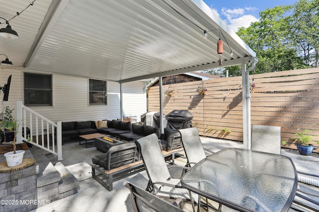 602 Butler Ave, Point Pleasant, NJ 08742 - fenced backyard with a patio, outdoor dining area, an outdoor living space with a fire pit, and grilling area