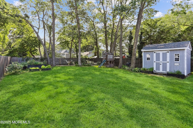 602 Butler Ave, Point Pleasant, NJ 08742 - fenced backyard featuring a playground and a storage shed