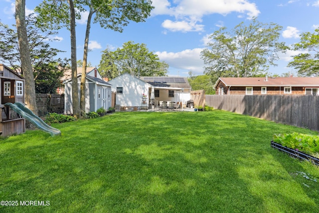 602 Butler Ave, Point Pleasant, NJ 08742 - fenced backyard with a patio area, a playground, and a storage shed