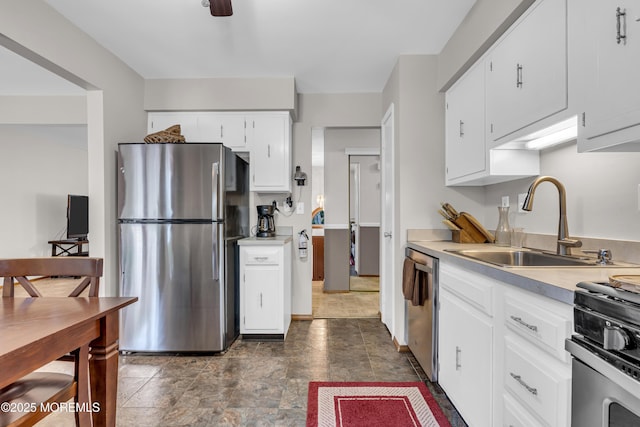 5 Partree Rd, Jackson, NJ 08527 - kitchen featuring appliances with stainless steel finishes, light countertops, white cabinetry, and stone finish flooring