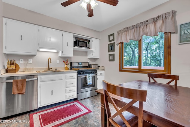 5 Partree Rd, Jackson, NJ 08527 - kitchen with appliances with stainless steel finishes, light countertops, white cabinetry, and a ceiling fan