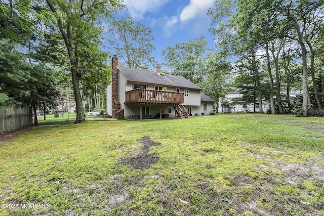 5 Partree Rd, Jackson, NJ 08527 - rear view of house with a wooden deck, stairway, a fenced backyard, and a chimney