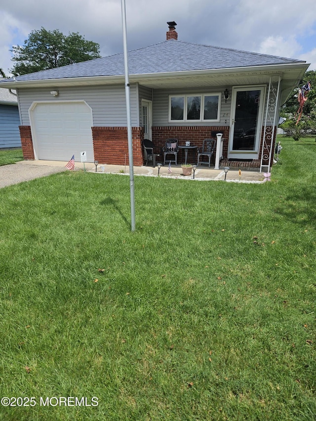 24 Christiansted St, Toms River, NJ 08757 - view of front of property with brick siding, a front lawn, an attached garage, a chimney, and a shingled roof