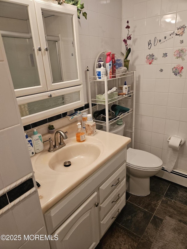 24 Christiansted St, Toms River, NJ 08757 - bathroom with tile walls, vanity, and baseboard heating