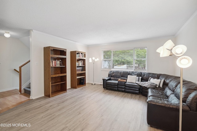 28 Dortmunder Dr, Manalapan, NJ 07726 - living room with light wood finished floors, ornamental molding, stairs, and a textured ceiling