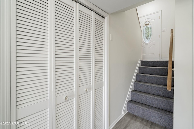 28 Dortmunder Dr, Manalapan, NJ 07726 - stairway with baseboards and wood finished floors