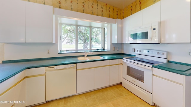 2 Patty Dr, Wrightstown, NJ 08562 - kitchen with white appliances, dark countertops, and white cabinetry