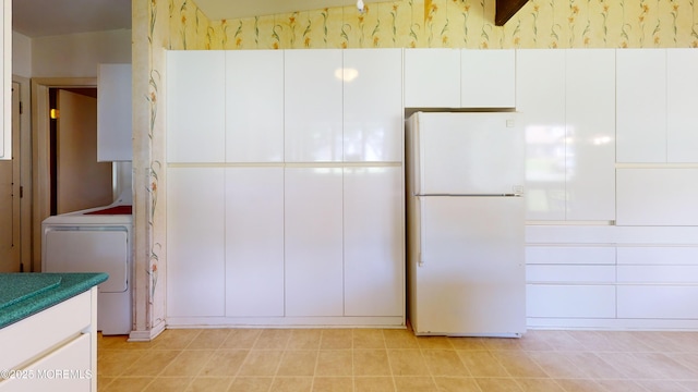 2 Patty Dr, Wrightstown, NJ 08562 - kitchen with freestanding refrigerator, washer / clothes dryer, white cabinets, and wallpapered walls