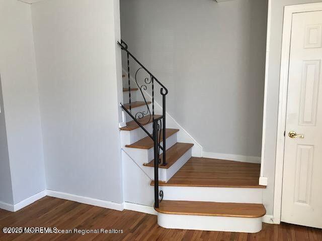 101 Village Green Way, Hazlet, NJ 07730 - staircase with wood finished floors and baseboards