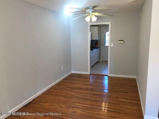 101 Village Green Way, Hazlet, NJ 07730 - unfurnished room with a ceiling fan and light wood-style floors