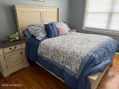 101 Village Green Way, Hazlet, NJ 07730 - bedroom featuring wood finished floors