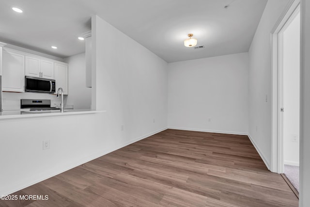 750 Lighthouse Dr Unit 3201, Barnegat, NJ 08005 - unfurnished dining area featuring wood finished floors and recessed lighting