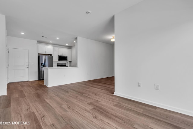 750 Lighthouse Dr Unit 3201, Barnegat, NJ 08005 - unfurnished living room with recessed lighting and wood finished floors