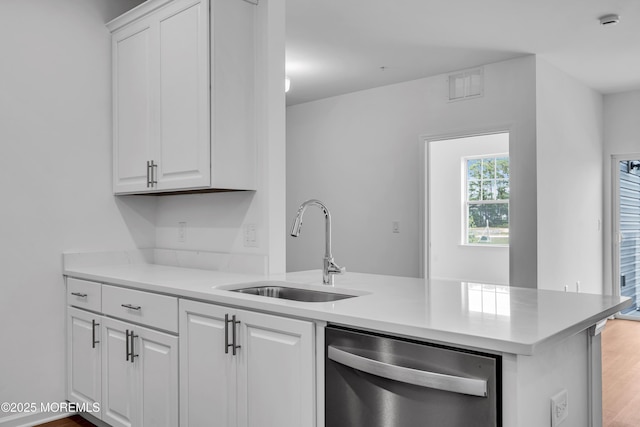 750 Lighthouse Dr Unit 3201, Barnegat, NJ 08005 - kitchen featuring dishwasher, white cabinets, a peninsula, light countertops, and light wood finished floors