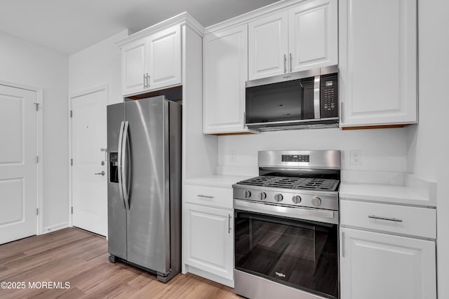 750 Lighthouse Dr Unit 3201, Barnegat, NJ 08005 - kitchen featuring stainless steel appliances, light countertops, light wood-style flooring, and white cabinets
