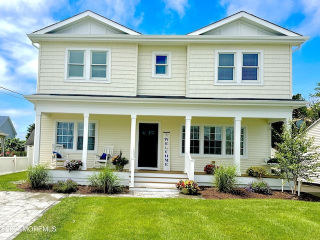 1810 Shore Blvd, Point Pleasant, NJ 08742 - view of front of house with a porch, a front lawn, and board and batten siding