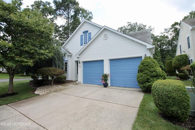 2 Dowing Ln, Jackson, NJ 08527 - view of side of property featuring an attached garage and concrete driveway