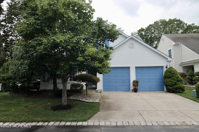 2 Dowing Ln, Jackson, NJ 08527 - view of front of home featuring concrete driveway, an attached garage, and a front lawn