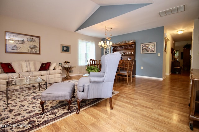 2 Dowing Ln, Jackson, NJ 08527 - living area featuring a chandelier, light wood-style flooring, and vaulted ceiling