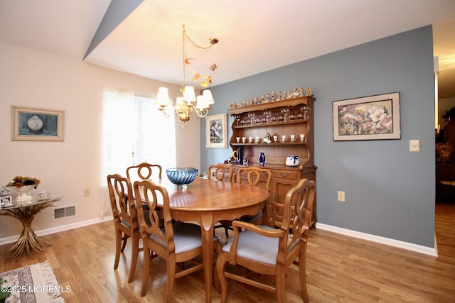 2 Dowing Ln, Jackson, NJ 08527 - dining space featuring light wood-type flooring and a chandelier