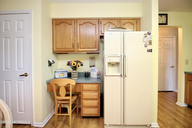 2 Dowing Ln, Jackson, NJ 08527 - kitchen with white fridge with ice dispenser, light wood-style floors, and built in study area
