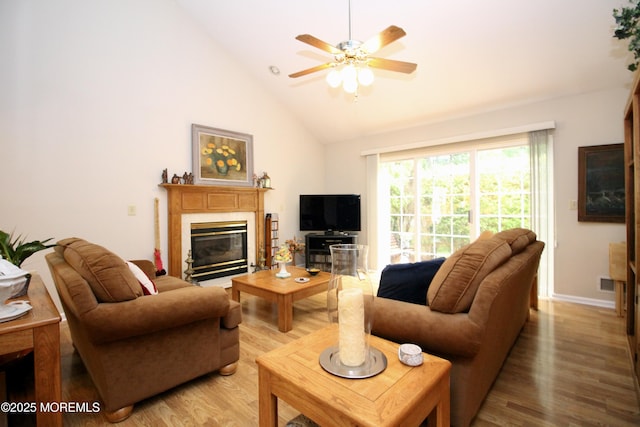 2 Dowing Ln, Jackson, NJ 08527 - living area featuring light wood-style floors, ceiling fan, a tile fireplace, and high vaulted ceiling