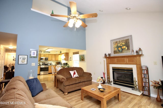 2 Dowing Ln, Jackson, NJ 08527 - living area featuring light wood-style floors, a ceiling fan, a towering ceiling, and a fireplace