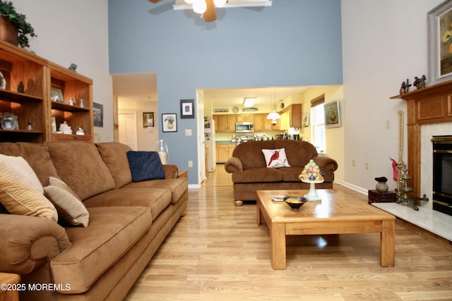 2 Dowing Ln, Jackson, NJ 08527 - living room with a towering ceiling, a ceiling fan, light wood-type flooring, and a premium fireplace