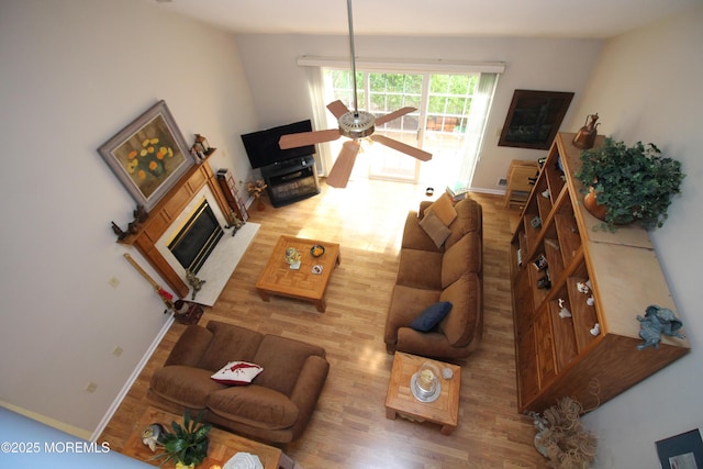 2 Dowing Ln, Jackson, NJ 08527 - living area with wood finished floors, ceiling fan, and a glass covered fireplace