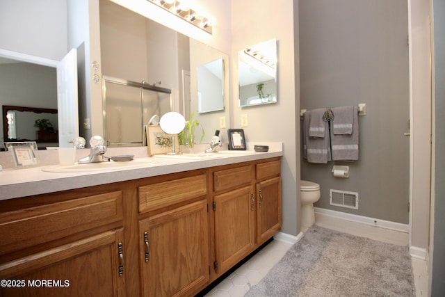 2 Dowing Ln, Jackson, NJ 08527 - bathroom with double vanity, tile patterned floors, and a shower with door
