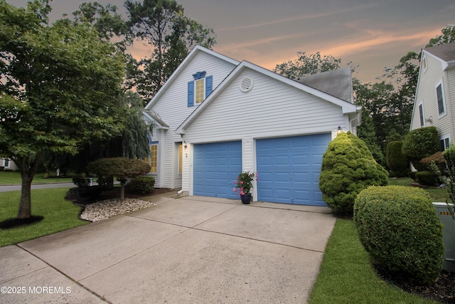 2 Dowing Ln, Jackson, NJ 08527 - view of front of house featuring driveway, a garage, and a yard