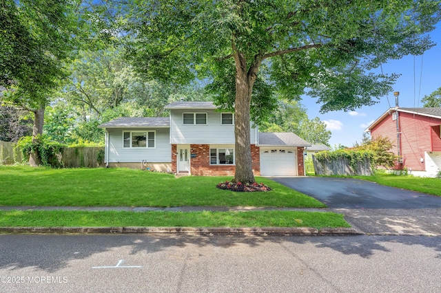 23 Montana Dr, Jackson, NJ 08527 - view of front of property featuring an attached garage, asphalt driveway, and brick siding