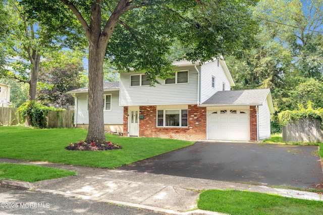 23 Montana Dr, Jackson, NJ 08527 - tri-level home featuring an attached garage, driveway, brick siding, and roof with shingles