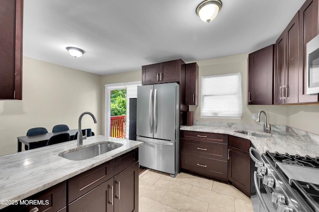 23 Montana Dr, Jackson, NJ 08527 - kitchen featuring stainless steel appliances, light stone countertops, light tile patterned flooring, and dark brown cabinetry
