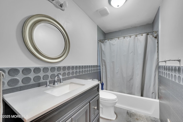 23 Montana Dr, Jackson, NJ 08527 - bathroom featuring tile walls, vanity, shower / bath combo with shower curtain, a wainscoted wall, and tile patterned floors