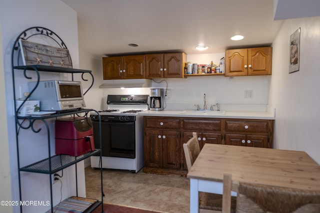 28 Florence Ave, Leonardo, NJ 07737 - kitchen with white stove, under cabinet range hood, open shelves, and wooden counters