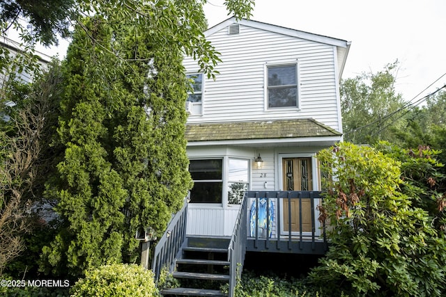 28 Florence Ave, Leonardo, NJ 07737 - view of front facade with a wooden deck and stairs