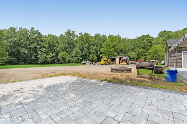 135 E Veterans Hwy, Jackson, NJ 08527 - view of patio featuring a playground and a storage unit