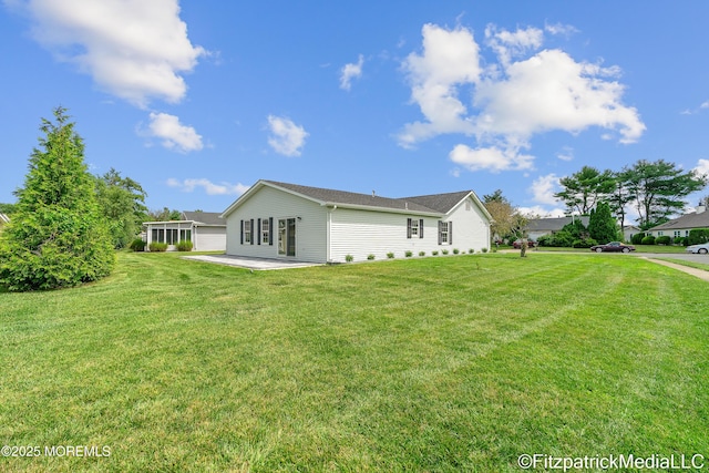 13 Everest Dr N, Brick, NJ 08724 - view of side of property featuring a patio and a lawn