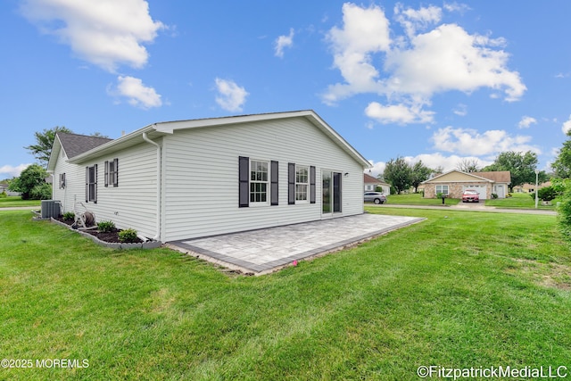 13 Everest Dr N, Brick, NJ 08724 - rear view of house with a lawn and a patio area