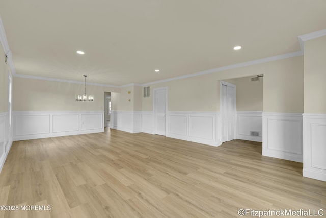 13 Everest Dr N, Brick, NJ 08724 - unfurnished room with a chandelier, wainscoting, recessed lighting, light wood-type flooring, and ornamental molding