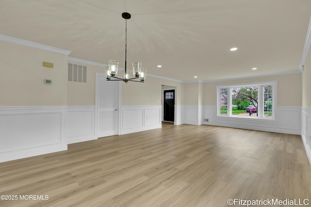 13 Everest Dr N, Brick, NJ 08724 - unfurnished dining area with a chandelier, ornamental molding, wainscoting, recessed lighting, and a decorative wall