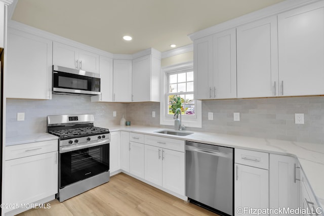 13 Everest Dr N, Brick, NJ 08724 - kitchen featuring stainless steel appliances, white cabinetry, light wood-style floors, backsplash, and recessed lighting