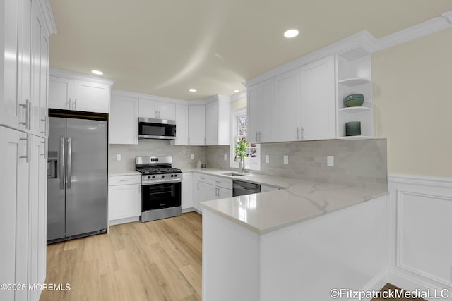 13 Everest Dr N, Brick, NJ 08724 - kitchen with open shelves, stainless steel appliances, white cabinetry, a peninsula, and light wood-style floors