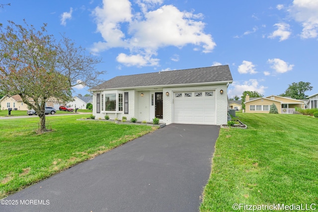 13 Everest Dr N, Brick, NJ 08724 - single story home with an attached garage, brick siding, asphalt driveway, a front lawn, and a shingled roof