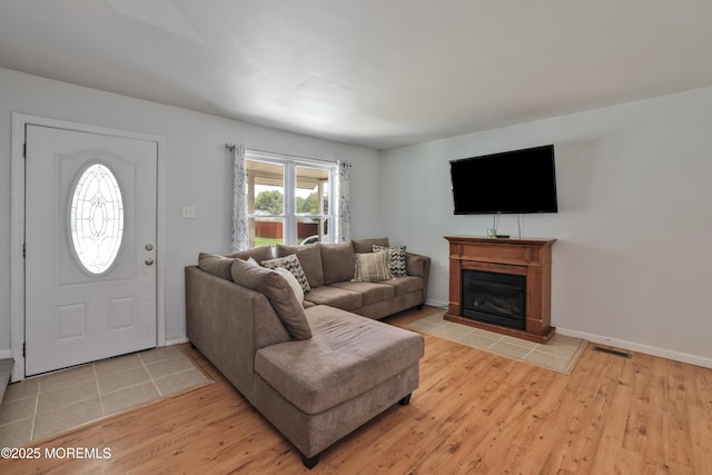 107 Seneca Lake Dr, Little Egg Harbor, NJ 08087 - living room with light wood finished floors and a glass covered fireplace